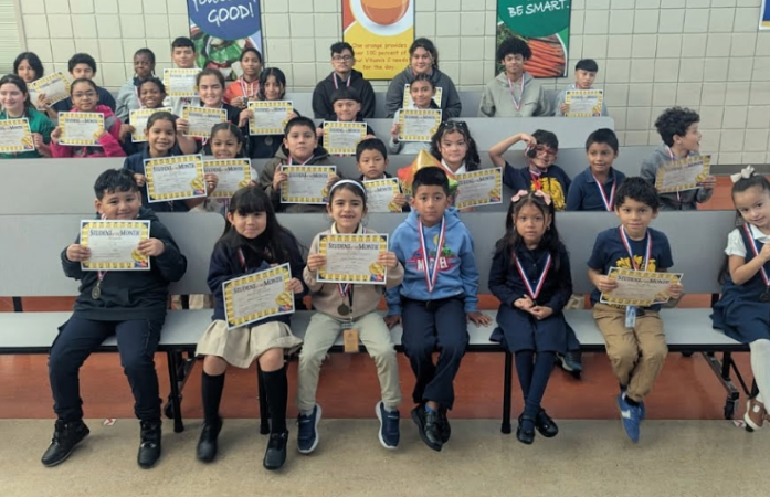  Student of the month students holding certificates 